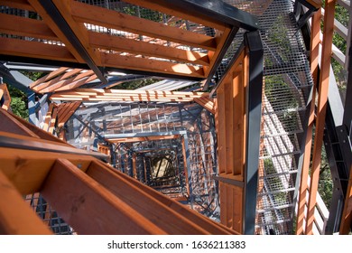 Tall wooden & metal lookout tower in forest. Sunny summer day. - Powered by Shutterstock