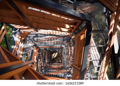 Tall wooden & metal lookout tower in forest. Sunny summer day. - Powered by Shutterstock