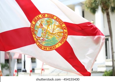 Tallahassee, FL - July 2016 - State of Florida flag that has the official seal of the state is planted at the East entrance of Old State Capitol in Tallahassee, Florida. 