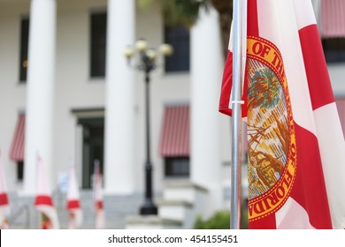 Tallahassee, FL - July 2016 - State of Florida flag that has the official seal of the state is planted at the East entrance of Old State Capitol in Tallahassee, Florida. Getting ready for elections.