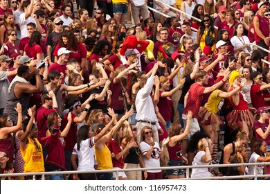 TALLAHASSEE, FL - OCT. 27:  FSU Seminole Fans Celebrate A Touchdown By Doing The Seminole Chop, A Repetitive Chopping Motion To Symbolize A Tomahawk Swinging Down, In Tallahassee On Oct. 27, 2012.