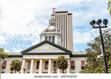 Tallahassee, USA - April 26, 2018: Exterior state capitol building in Florida during day with modern architecture of government and lamp and palm trees