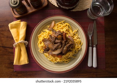 Tallarines Con Lomo Saltado Plate Of Noodles Spaghetti Pasta Comfort Food Wooden Dining Table With Sauted Meat