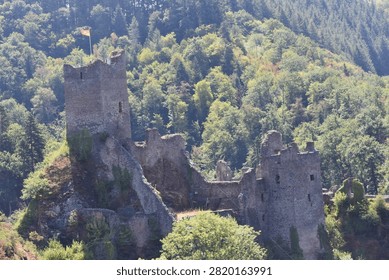 The tallest tower dominates the ruins, while scattered walls hint at the once-impressive medieval stronghold that guarded this strategic borderland.
