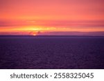 Tallin, Harju County, Estonia — August 16 2024: Sunset over the Gulf of Finland seen from the Tallink ferry in Tallin, Estonia.