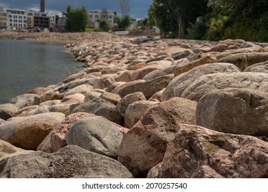 Tallinn Cityscape. View Of Kalaranna District And New Apartment Buildings. Baltic Sea And Big Stones In The Foreground. Focus On The Stones.