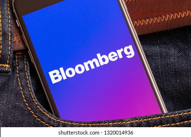 Tallinn / Estonia - 02/22/2019: Black Phone With Logo Of News Media Bloomberg On The Screen. News Media Icon. Denim Jeans Background