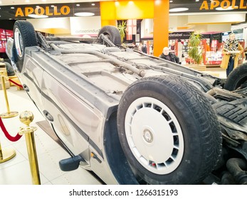 TALLINN, ESTONIA - DETSEMBER 16, 2018: Volvo Turned Upside-down After Road Collision In Kristiine Shopping Centre. Old  Overturned Car Accident Scene Upside Down On Shop Floor. Copy Space For Text Box