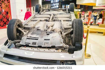 TALLINN, ESTONIA - DETSEMBER 16, 2018: Volvo Turned Upside-down After Road Collision In Kristiine Shopping Centre. Old  Overturned Car Accident Scene Upside Down On Shop Floor. Copy Space For Text Box