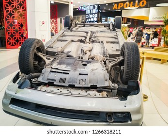 TALLINN, ESTONIA - DETSEMBER 16, 2018: Volvo Turned Upside-down After Road Collision In Kristiine Shopping Centre. Old  Overturned Car Accident Scene Upside Down On Shop Floor. Copy Space For Text Box