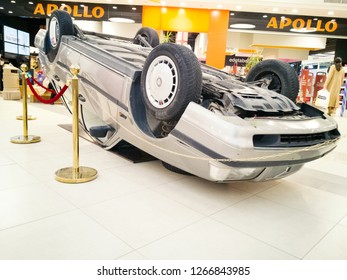 TALLINN, ESTONIA - DETSEMBER 16, 2018: Volvo Turned Upside-down After Road Collision In Kristiine Shopping Centre. Old  Overturned Car Accident Scene Upside Down On Shop Floor. Copy Space For Text Box