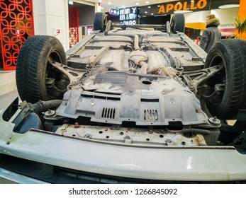 TALLINN, ESTONIA - DETSEMBER 16, 2018: Volvo Turned Upside-down After Road Collision In Kristiine Shopping Centre. Old  Overturned Car Accident Scene Upside Down On Shop Floor. Copy Space For Text Box