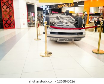 TALLINN, ESTONIA - DETSEMBER 16, 2018: Volvo Turned Upside-down After Road Collision In Kristiine Shopping Centre. Old  Overturned Car Accident Scene Upside Down On Shop Floor. Copy Space For Text Box