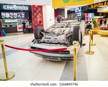 TALLINN, ESTONIA - DETSEMBER 16, 2018: Volvo Turned Upside-down After Road Collision In Kristiine Shopping Centre. Old  Overturned Car Accident Scene Upside Down On Shop Floor. Copy Space For Text Box