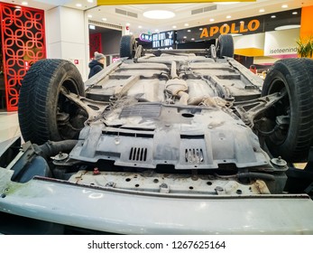 TALLINN, ESTONIA - DETSEMBER 16, 2018: Volvo Turned Upside-down After Road Collision In Kristiine Shopping Centre. Old  Overturned Car Accident Scene Upside Down On Shop Floor. Copy Space For Text Box