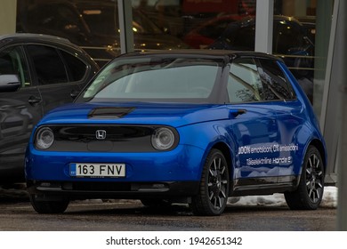 Tallinn, Estonia - March 12 2021: New Blue Electric Car Honda E Parked At The Front Of Honda Center In Tallinn. Cloudy Winter Day. 