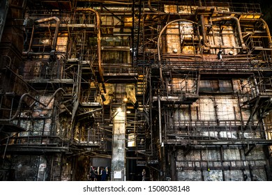 Tallinn / Estonia - September 18 2019: An Industrial-looking Historic Building Which Is Creative Hub Today. High Wall Full Of Old Constructions From Pre-war Period Power Plant Boiler Room.  