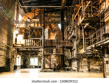 Tallinn / Estonia - September 18 2019: An Industrial-looking Historic Building Which Is Creative Hub Today. Old Wall Full Of Rusty Constructions From Pre-war Period Power Plant Boiler Room.  