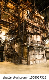 Tallinn / Estonia - September 18 2019: An Industrial-looking Historic Building Which Is Creative Hub Today. Old Wall Full Of Rusty Constructions From Pre-war Period Power Plant Boiler Room.  