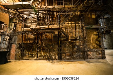 Tallinn / Estonia - September 18 2019: An Industrial-looking Historic Building Which Is Creative Hub Today. Old Wall Full Of Rusty Constructions From Pre-war Period Power Plant Boiler Room.  