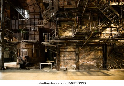 Tallinn / Estonia - September 18 2019: An Industrial-looking Historic Building Which Is Creative Hub Today. Old Wall Full Of Rusty Constructions From Pre-war Period Power Plant Boiler Room.  