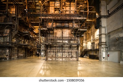 Tallinn / Estonia - September 18 2019: An Industrial-looking Historic Building Which Is Creative Hub Today. Old Wall Full Of Rusty Constructions From Pre-war Period Power Plant Boiler Room.  