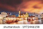 Tallinn, Estonia. Traditional Christmas Market On Town Hall Square. Trading Houses With Sale Of Christmas Gifts. Night Sky Above Famous Landmark. Altered Night Sky. Panorama, Panoramic View.