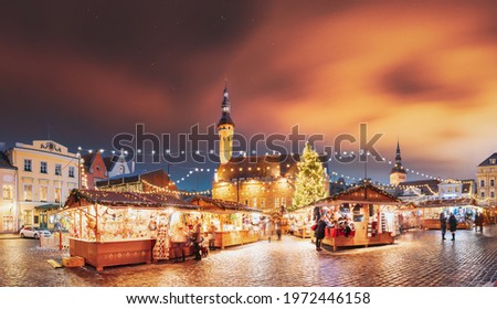 Tallinn, Estonia. Traditional Christmas Market On Town Hall Square. Trading Houses With Sale Of Christmas Gifts. Night Sky Above Famous Landmark. Altered Night Sky. Panorama, Panoramic View.