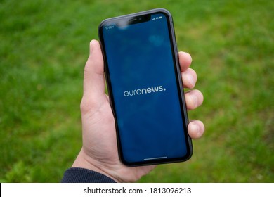 Tallinn/Estonia - September 1, 2020: Black iPhone with logo of news media EuroNews on the screen. News media icon. Business suit on the background
