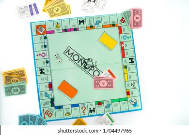 Tallinn/Estonia-04.11.2020: Monopoly Board Game. Family Fun Activity During Corona Outbreak. Strategy Board Games. Intelligent Brain Games. White Background. Colorful Board Game - Monopoly. Paper Mone