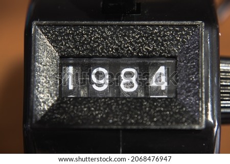 A tally counter showing a 1984 number