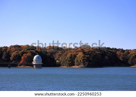 Tama lake and intake tower with Mt. Fuji in autumn in Tokyo, Japan