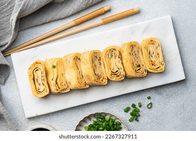 Tamagoyaki, Japanese rolled omelette, top view - Shutterstock ID 2267327911