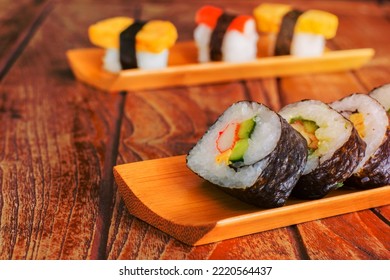 Tamagoyaki Maki With Seaweed Wrap On Wooden Tray. Delicious Japaneses Food.