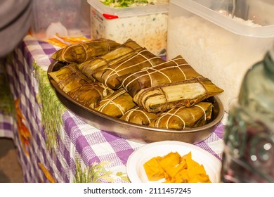 Tamales In An Aluminum Tray Along With Other Foods At A Market In Mexico, Selective Approach.