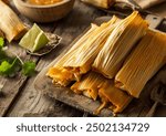 Tamales arranged in an artistic presentation on a plate, captured from an angle view. Professional food photo highlighting traditional Mexican cuisine.