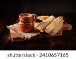 Tamales. hispanic dish typical of Mexico and some Latin American countries. Corn dough wrapped in corn leaves. The tamales are steamed.