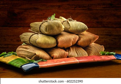 Tamales, Mexican dish made with corn dough, chicken or pork and chili, wrapped with a corn leaf