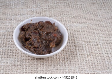 Tamarind Paste In Small Bowl.