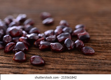 Tamarind Seed On Old Wood Table