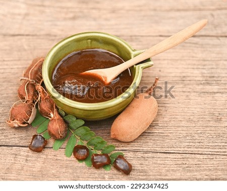 Tamarind set for health  Beauty treatment spa, hair, skin scrub,  Tamarind ripe peel shell, seeds in wood spoon in chopboard place on wooden background. Stock photo © 