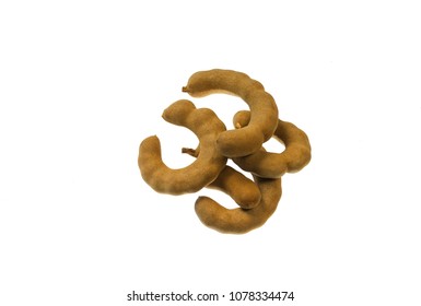 Tamarind - Sweet Ripe Tamarind With Isolated On A White Background.Tamarind  Is A Leguminous Tree In The Family Fabaceae Indigenous To Tropical Africa. The Genus Tamarindus Is A Monotypic Taxon.