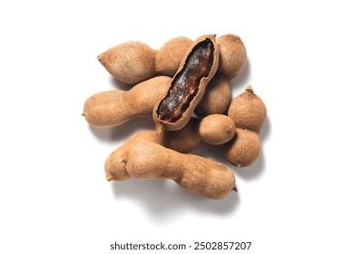 Tamarind tropical fruits isolated on white background. Fresh ripe dryed Tamarind fruits (Tamarindus indica, Indian date), healthy vegan food. Top view, flat lay - Powered by Shutterstock