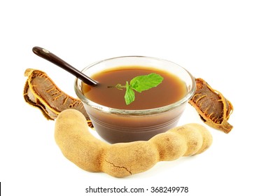 Tamarind With Tamarind Water Concentrate Chutney Pulp Or Paste On White Background