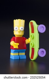 Tambov, Russian Federation - April 30, 2014 Lego Bart Simpson Minifigure With Skateboard On Black Background. Studio Shot.