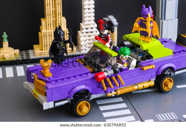 Tambov,\
Russian Federation - February 11, 2017 Lego Batman Movie. The Joker\
Notorious Lowrider in the city street with Batman, Batgirl, The\
Joker, Harley Quinn minifigures. Studio\
shot.