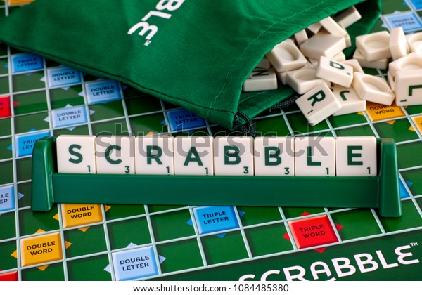 Tambov, Russian\
Federation - May 02, 2018 Scrabble Board Game. Word Scrabble from\
letter tiles in tile rack on  gameboard with drawstring letter bag.\
Studio shot.