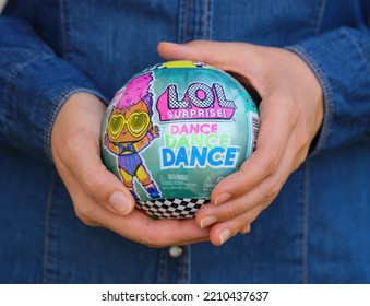 Tambov, Russian Federation - October 02, 2022 Woman Holding The LOL Surprise Dance Dance Dance Ball With Doll Inside It. 