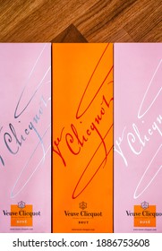 Tambov, Russian Federation - September 29, 2019 Three boxes of Champagne Veuve Clicquot Brut and Rose in a row. Wooden background.