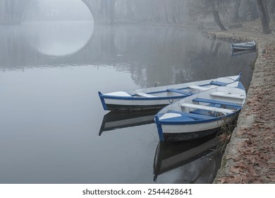 Tamega river traditional wooden boats, Amarante, north of Portugal, in a misty morning. - Powered by Shutterstock